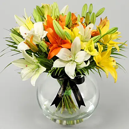 Mix Of Lilies In Fishbowl Vase