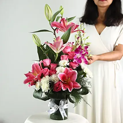 Elegant Mixed Flowers In Cylindrical Vase