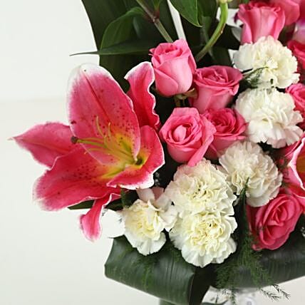 Elegant Mixed Flowers In Cylindrical Vase