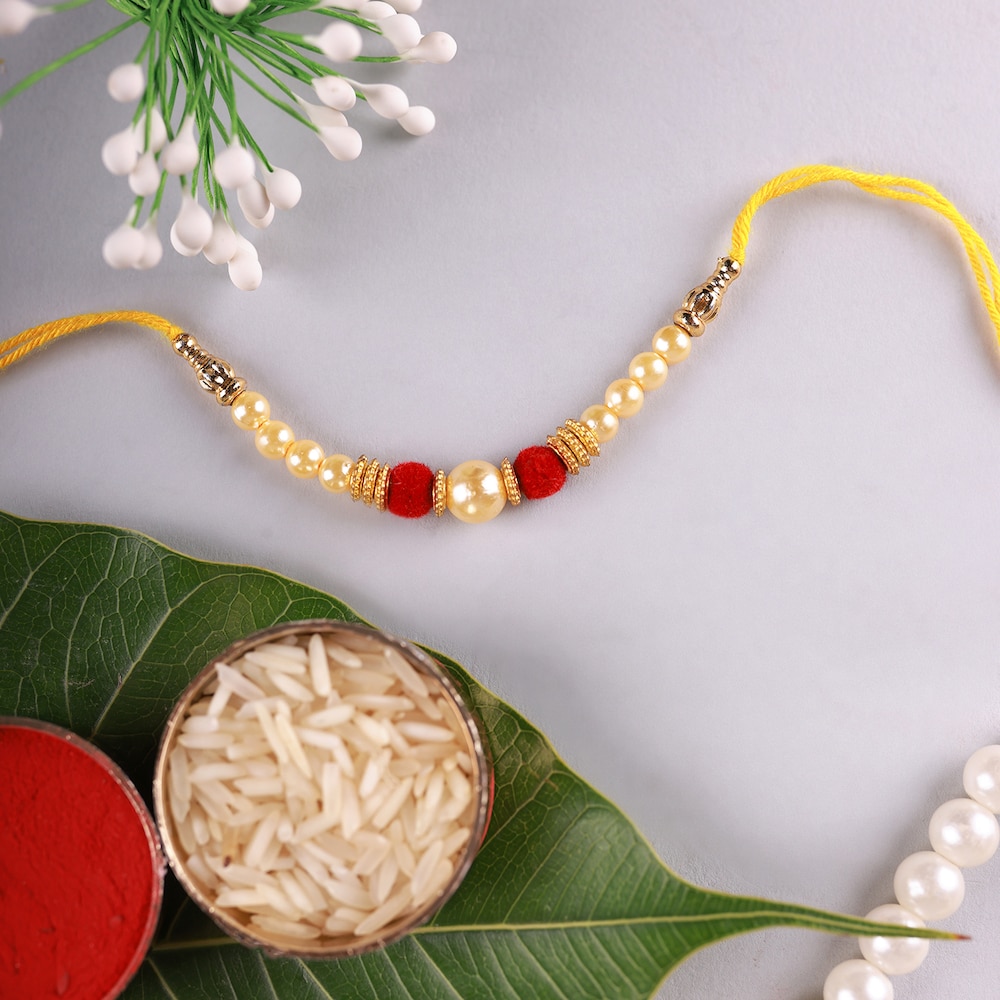 Red Flower Bouquet With Pearl Rakhi